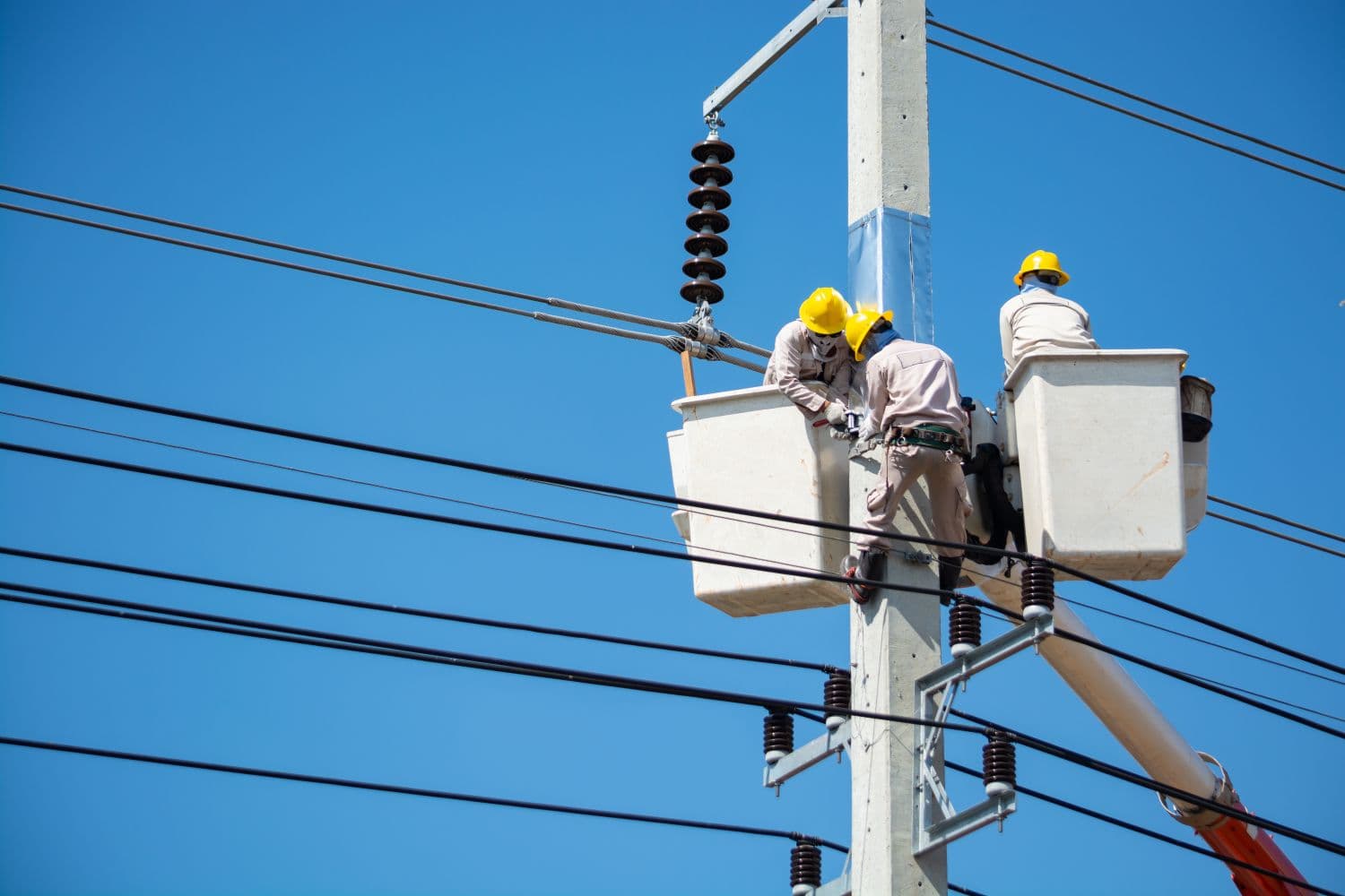 Scott-Del electrician working on overhead power line